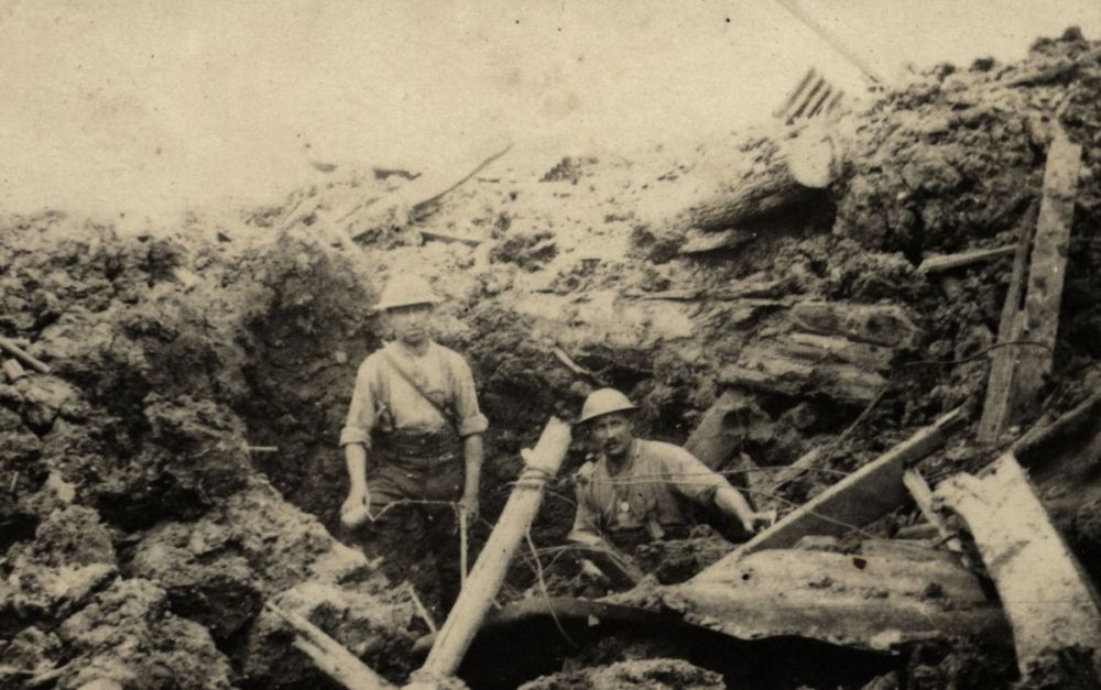 Two Allied soldiers in a destroyed German position at Messines.